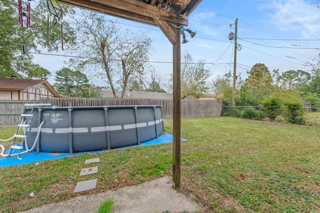 view of yard featuring a fenced in pool