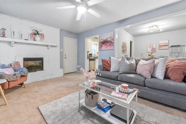 carpeted living room featuring ceiling fan and a brick fireplace