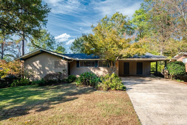 ranch-style house with a front yard and a carport