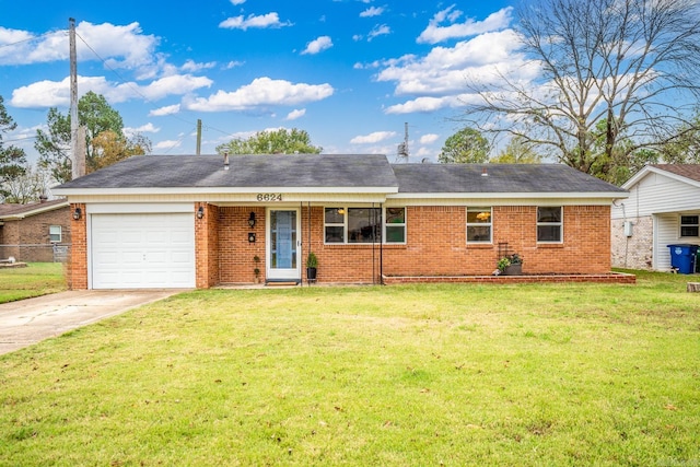 ranch-style house with a front lawn and a garage