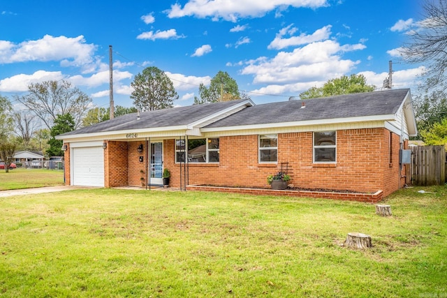 ranch-style home with a front yard and a garage