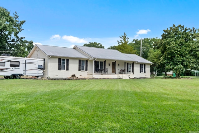 view of front of home with a front yard and covered porch