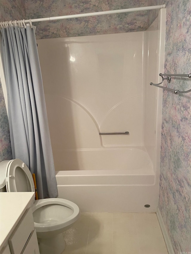 full bathroom with shower / bath combo, tile patterned flooring, vanity, and toilet