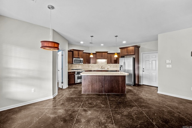 kitchen featuring a kitchen island, backsplash, appliances with stainless steel finishes, and hanging light fixtures