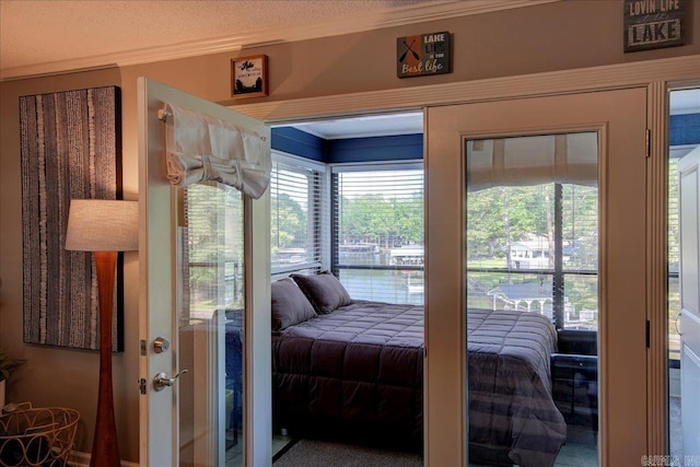 carpeted bedroom with crown molding