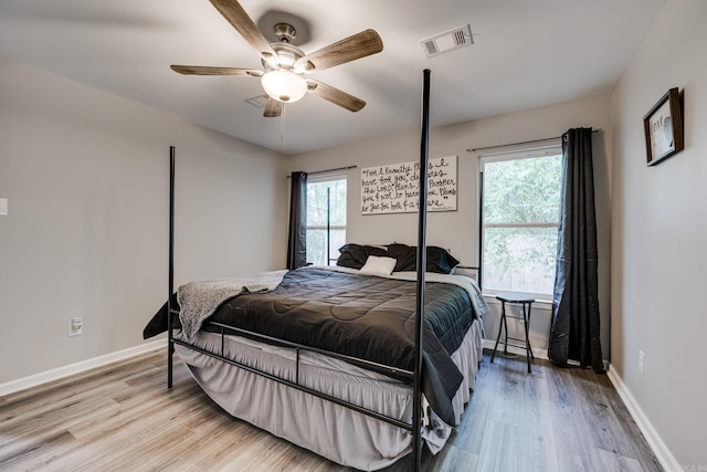 bedroom featuring light wood-type flooring and ceiling fan