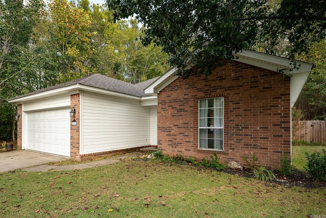 view of front of home with a garage and a front yard