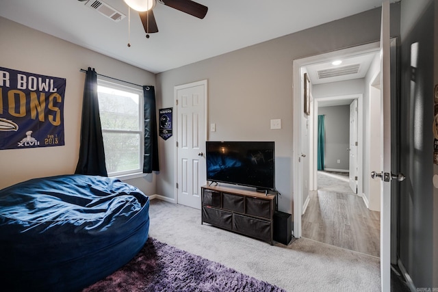 bedroom with ceiling fan and carpet flooring