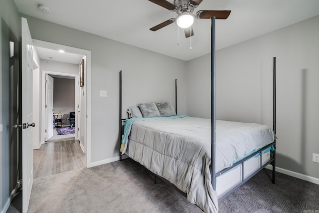 carpeted bedroom with ceiling fan