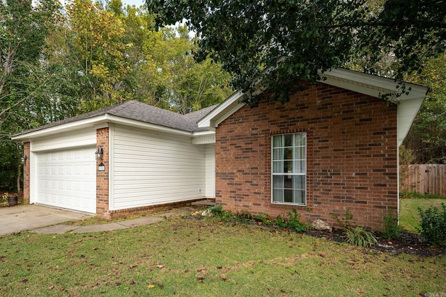 view of front of house featuring a garage and a front lawn