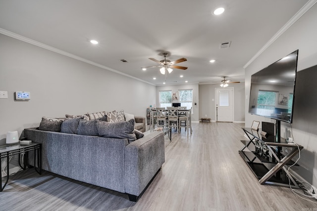 living room with ceiling fan, hardwood / wood-style flooring, and ornamental molding