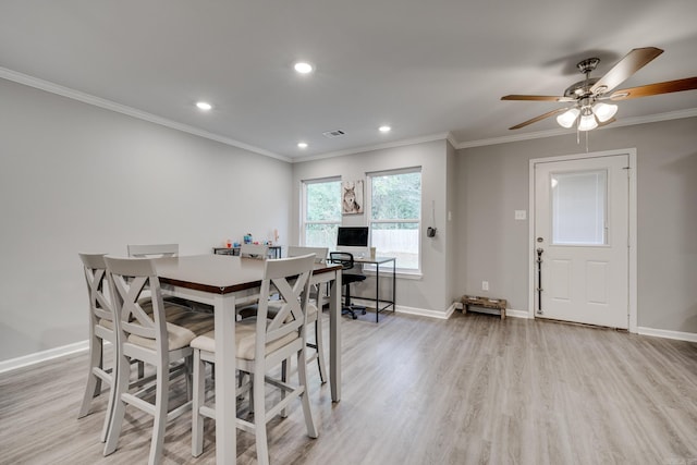 dining space featuring light hardwood / wood-style flooring, ornamental molding, and ceiling fan