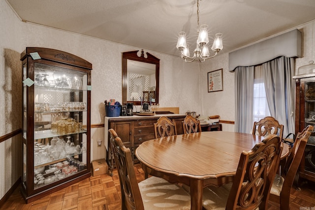 dining area featuring a textured ceiling, a notable chandelier, and parquet floors