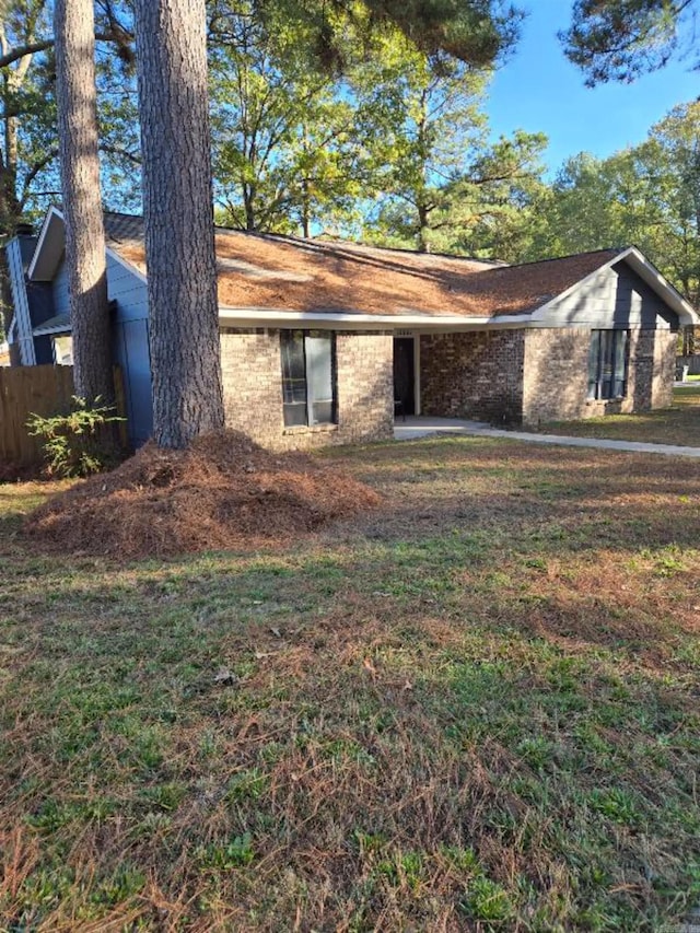 view of side of property featuring a yard