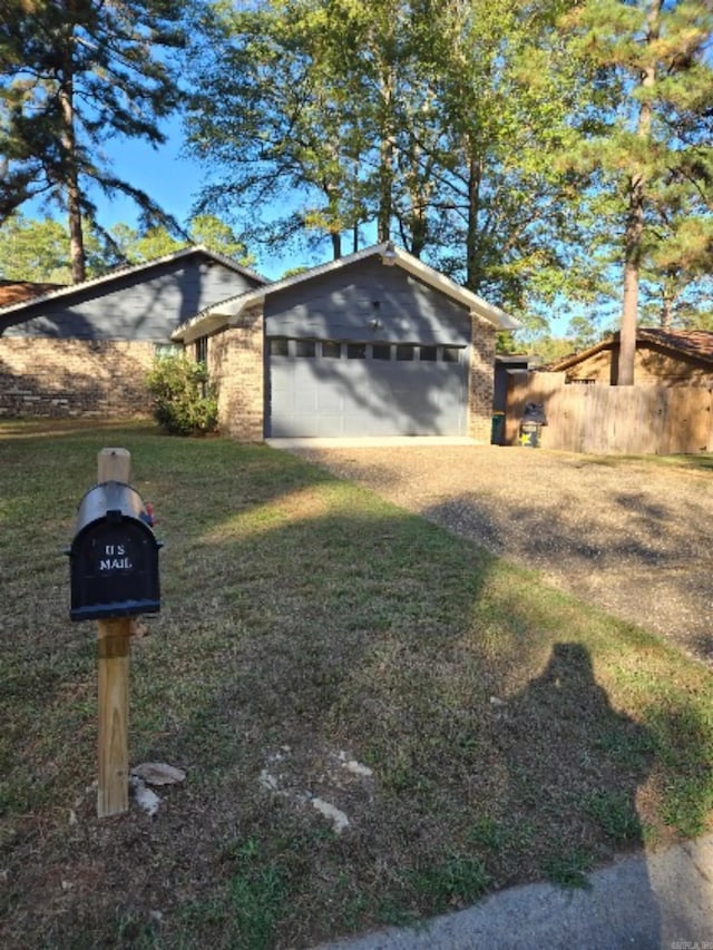 view of front of home with a garage and a front yard