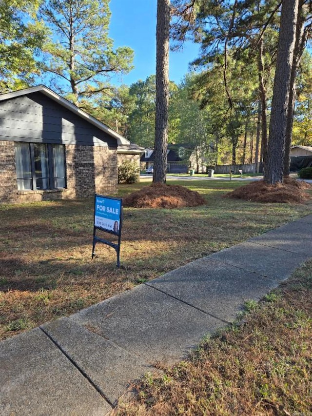 view of home's community featuring a lawn