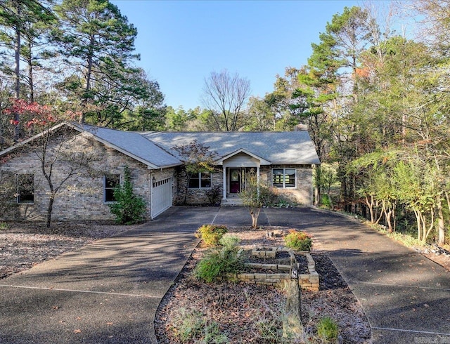 ranch-style house featuring a garage