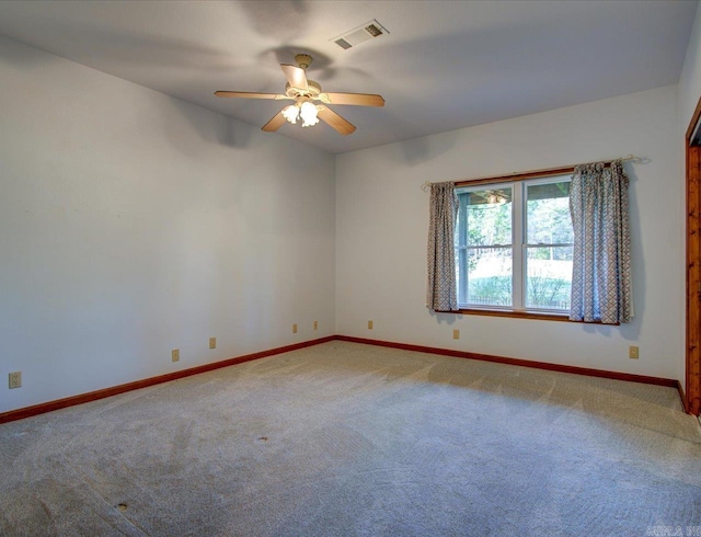 spare room with ceiling fan and carpet floors