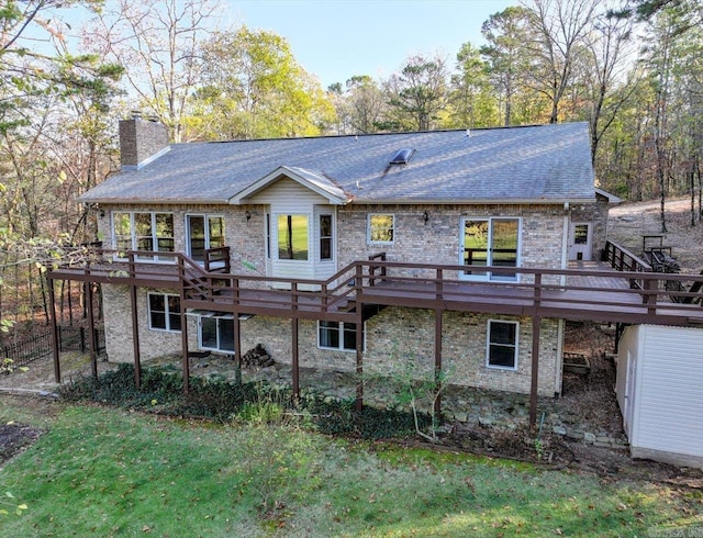 rear view of property with a wooden deck