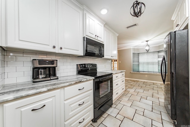 kitchen featuring black appliances, tasteful backsplash, light stone countertops, hanging light fixtures, and white cabinets