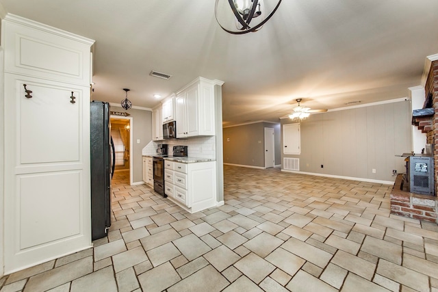 kitchen with white cabinetry, black appliances, light stone counters, ceiling fan, and decorative backsplash