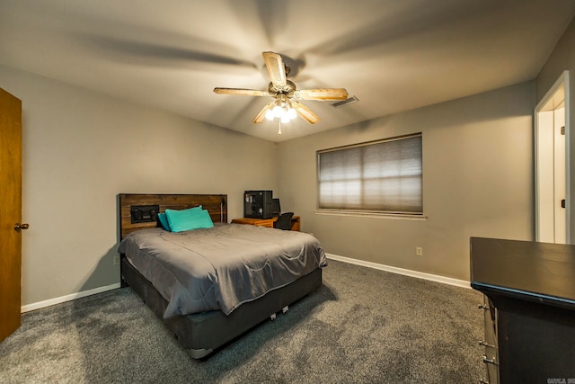 bedroom with ceiling fan and dark colored carpet