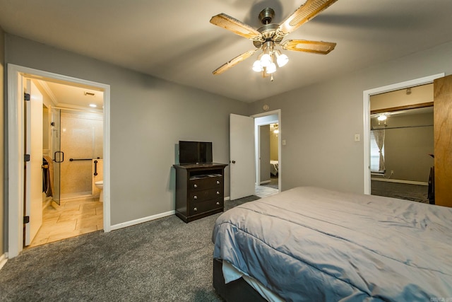 carpeted bedroom with ensuite bathroom and ceiling fan