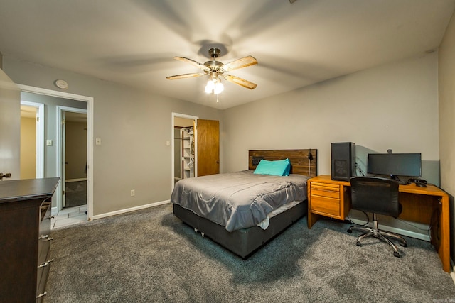 carpeted bedroom featuring a spacious closet, ceiling fan, and a closet