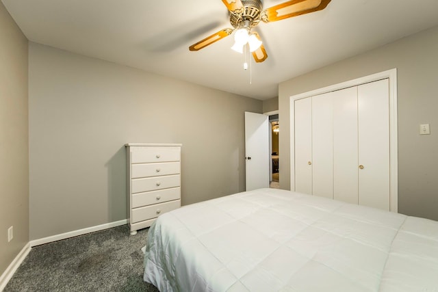 carpeted bedroom featuring ceiling fan and a closet