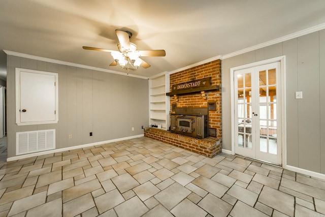 unfurnished living room with built in features, french doors, and ornamental molding