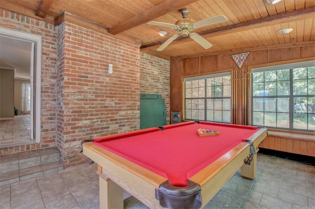 recreation room featuring wood walls, ceiling fan, wood ceiling, and beam ceiling