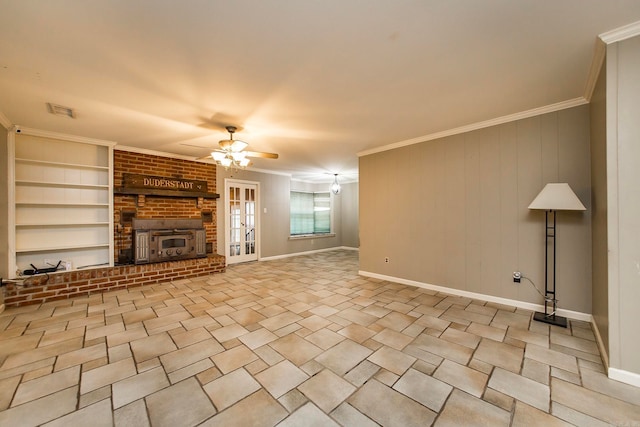 unfurnished living room featuring built in features, wooden walls, ceiling fan, and crown molding