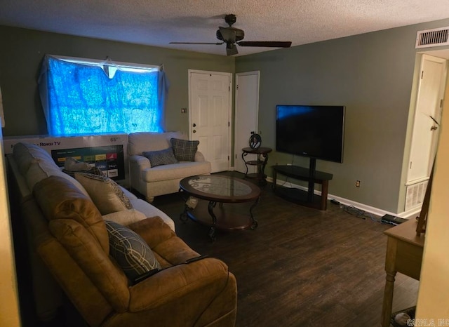 living room with ceiling fan, wood-type flooring, and a textured ceiling