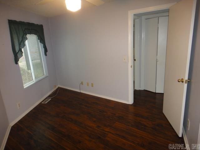 85 Bluff View Dr, Quitman, AR 72131 - empty room with wood finished floors, a ceiling fan, and baseboards