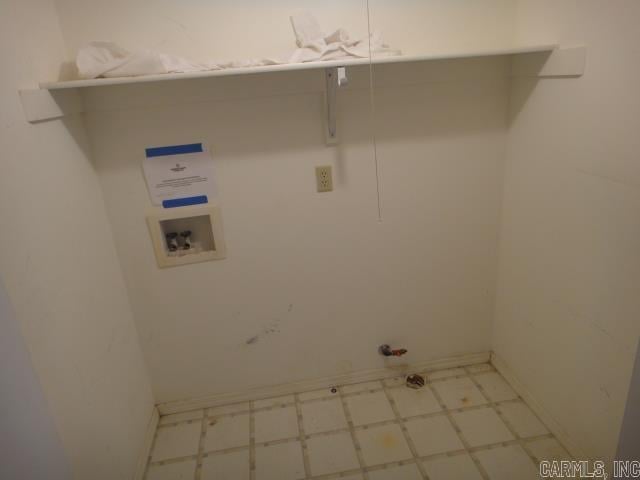 85 Bluff View Dr, Quitman, AR 72131 - laundry area with tile patterned floors, gas dryer hookup, washer hookup, and baseboards