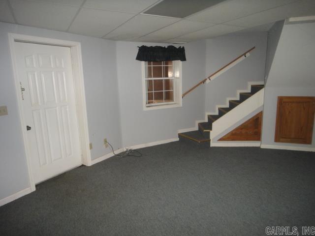 85 Bluff View Dr, Quitman, AR 72131 - finished below grade area with carpet floors, stairway, baseboards, and a drop ceiling
