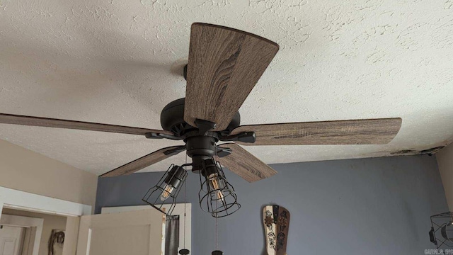 details featuring a textured ceiling and ceiling fan