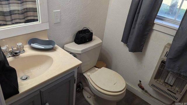 bathroom with toilet and vanity