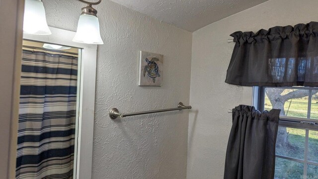 bathroom featuring a textured ceiling