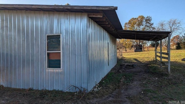 view of side of property with a lawn