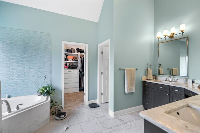 bathroom featuring high vaulted ceiling, vanity, and a tub