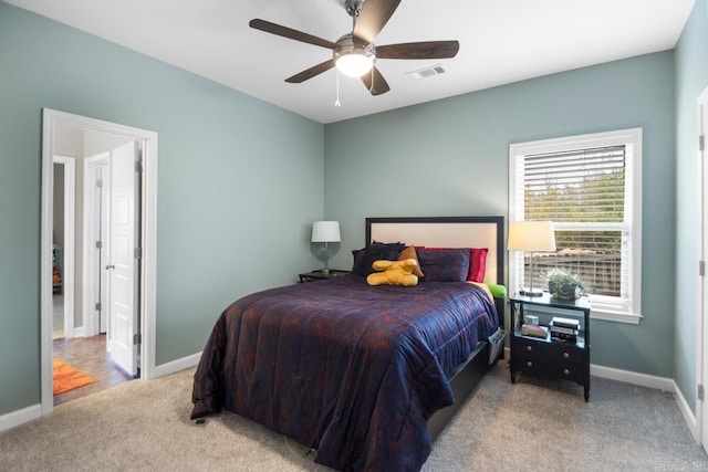 carpeted bedroom with ceiling fan