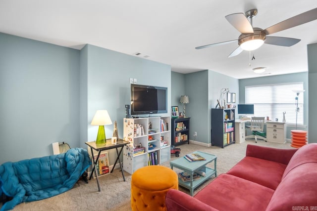 living room featuring ceiling fan and light carpet