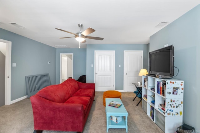 living room with carpet flooring and ceiling fan