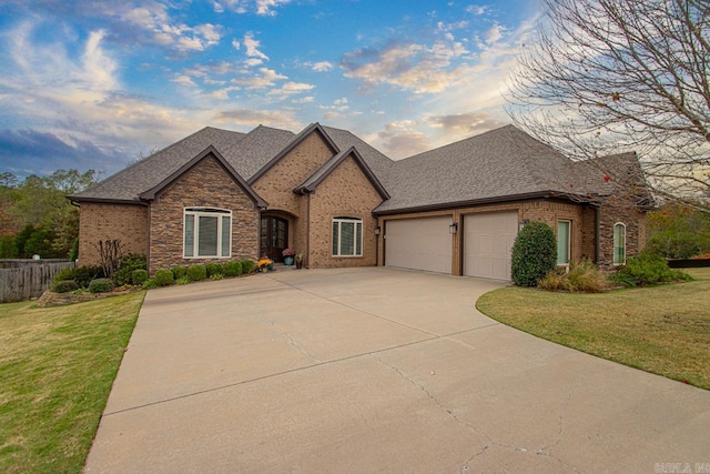 view of front of property with a garage and a front yard