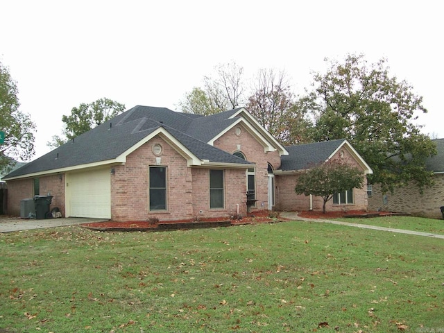 view of front of home featuring a garage and a front lawn