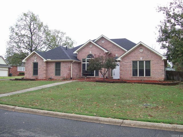 view of front of property with a front lawn