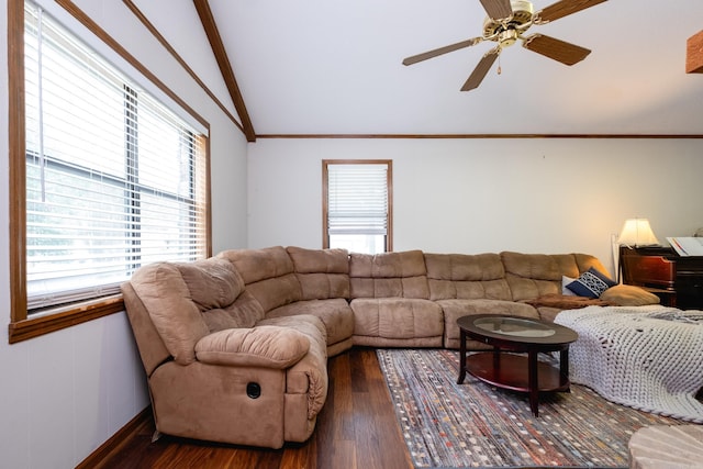 living room featuring dark hardwood / wood-style floors, ceiling fan, and vaulted ceiling