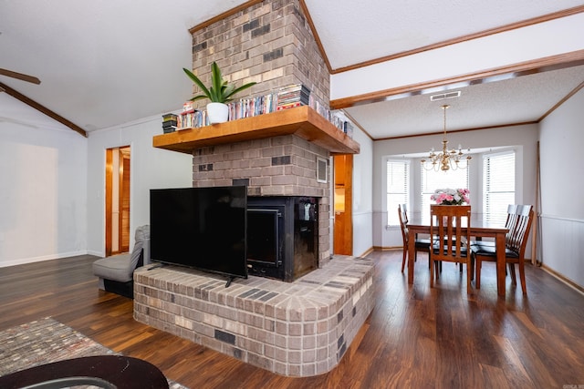 living room with dark hardwood / wood-style flooring, lofted ceiling, a notable chandelier, a textured ceiling, and ornamental molding