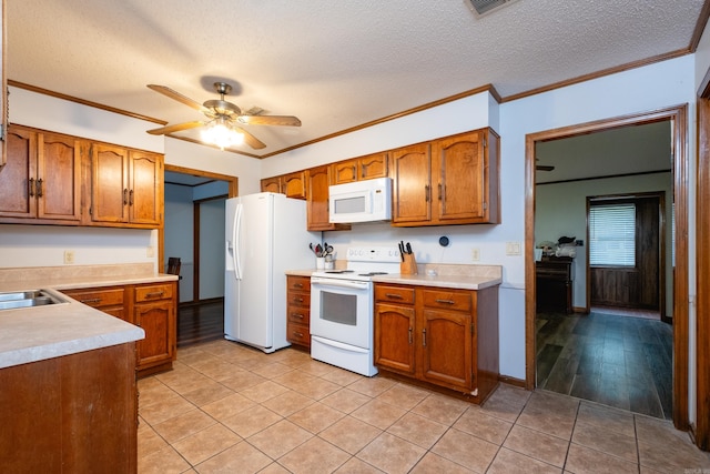 kitchen featuring ornamental molding, ceiling fan, a textured ceiling, white appliances, and light hardwood / wood-style flooring